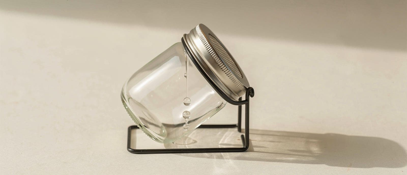 jar propped mouth-down in stand